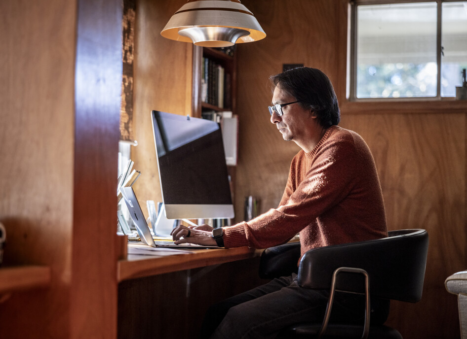 Man looking serious at a computer